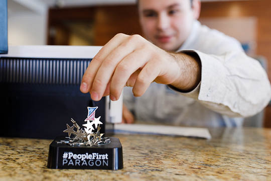Choice employee placing paragon magnet on paragon.