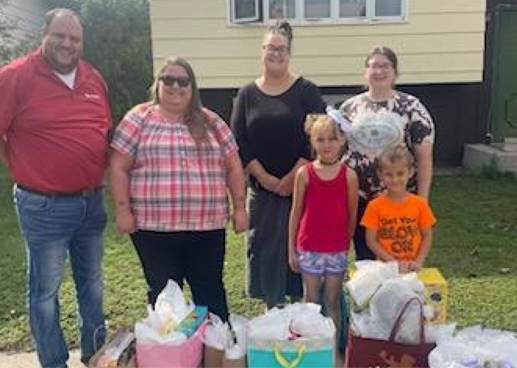 bank employees present 4 siblings with gifts