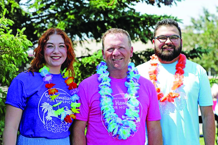 three individuals at Hawaiian for Hospice fundraiser