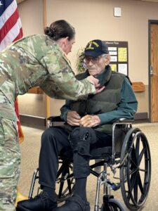 Man getting pinned for military service