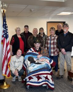 man smiling with family