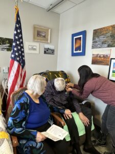 man receiving pin for military service